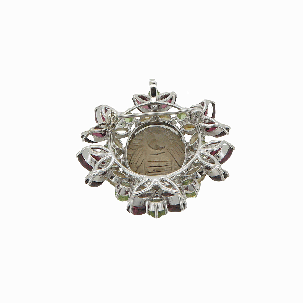 Spilla gioiello in argento con granato e topazi