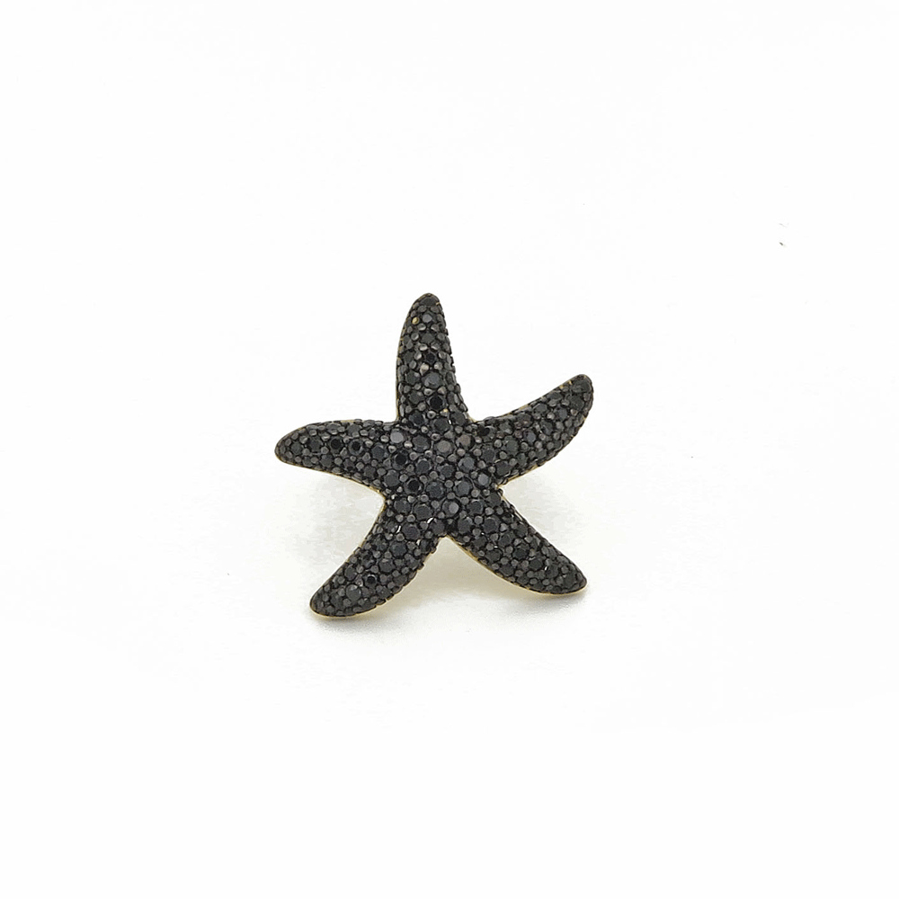 Anello con stella marina e zirconi neri