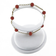 18 kt gold bracelet with red coral pearls