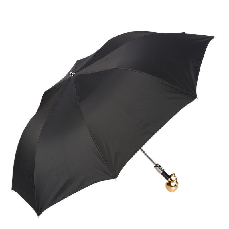 Black folding umbrella with gold skull