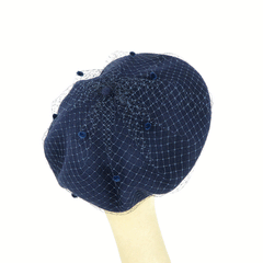 Basco in lana blu con veletta