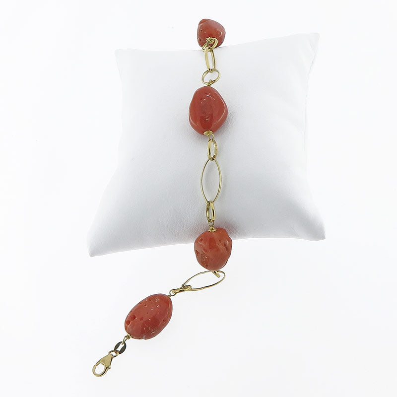 Bracciale in oro 18 kt e sassi di corallo