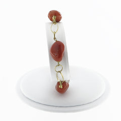 18 kt gold bracelet and coral stones