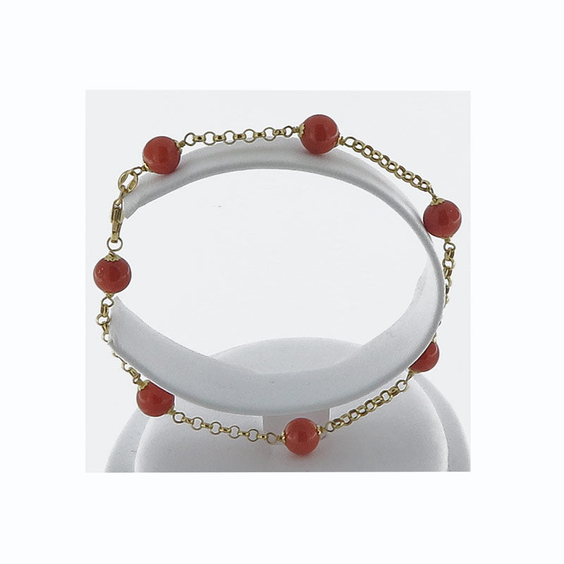 Bracciale in oro 18 kt con perle di corallo rosso
